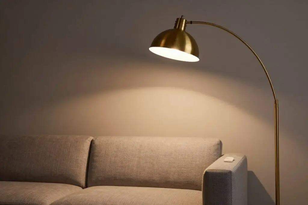 vintage arc floor lamp creating dramatic lighting in living space